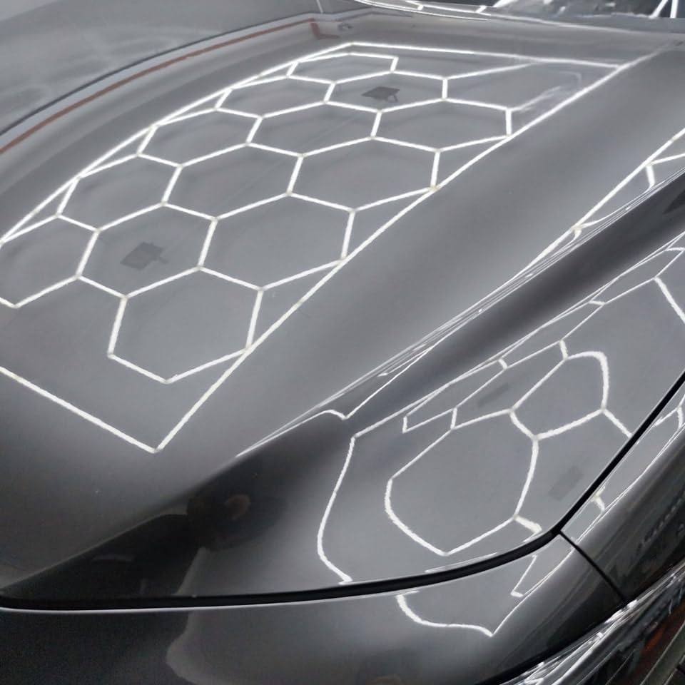 CARPRO EliXir Quick Detailer application scene showing even spray coverage