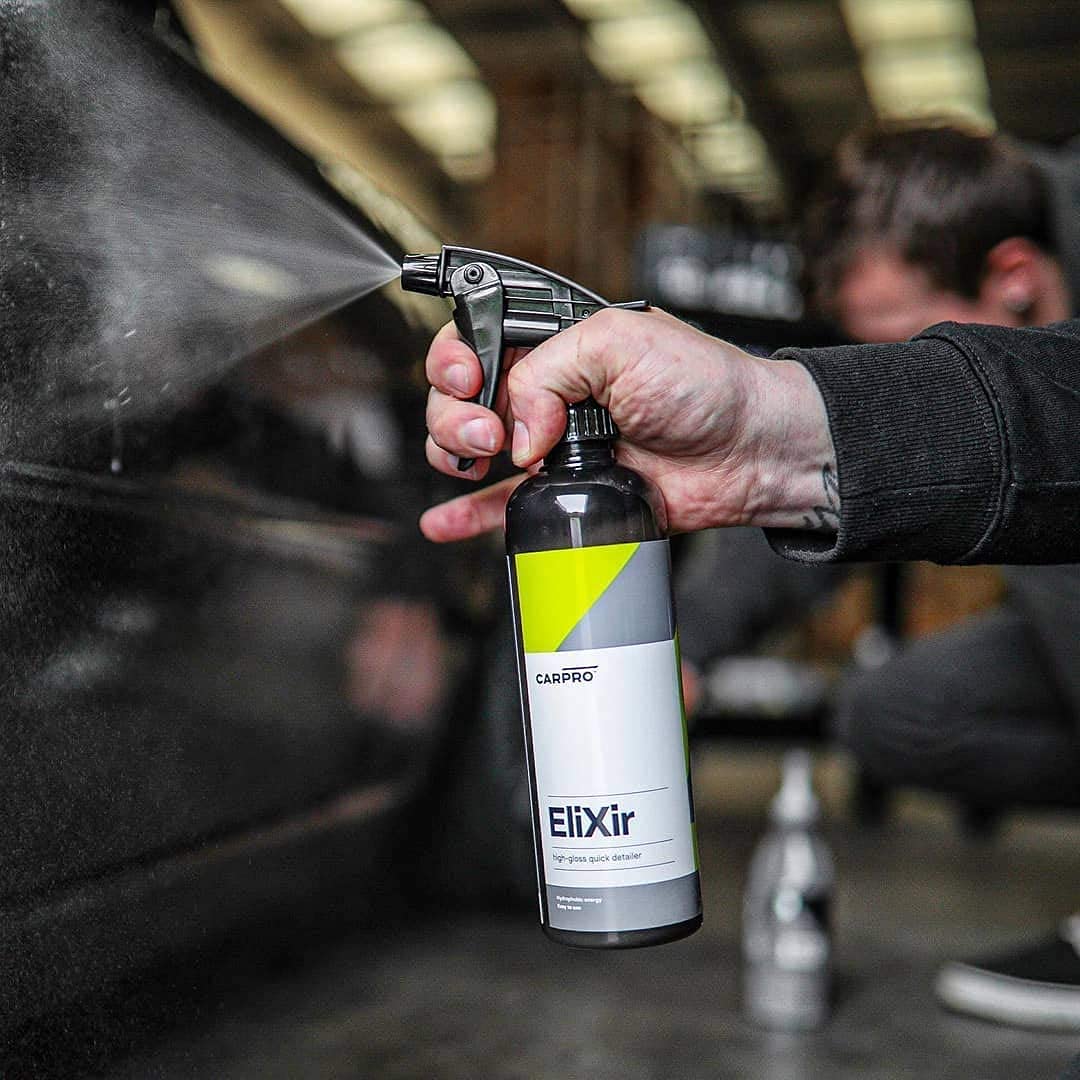 CARPRO Elixir spray application in progress on a panel