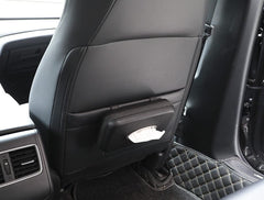 Cartisen tissue holder mounted on backseat for easy passenger access.