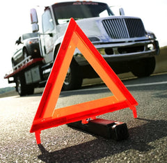 CARTMAN emergency triangle reflective panel close-up highlights high visibility at night.