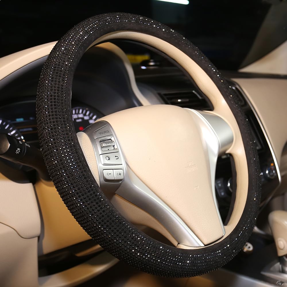Carwales closeup of black diamond crystals on wheel cover adds refined interior vibes.
