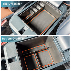 CDEFG Maverick armrest tray orange trim provides easy-access storage.