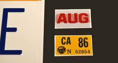 Celebrity Machines embossed aluminum plate offers durable wall decor.