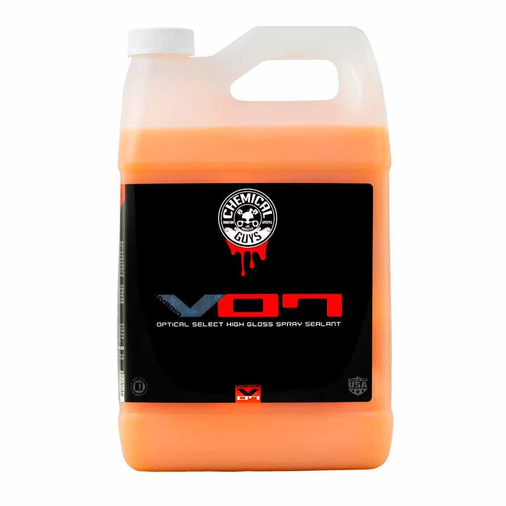 Chemical Guys Hybrid V7 spray-sealant bottle applying a protective glossy finish.