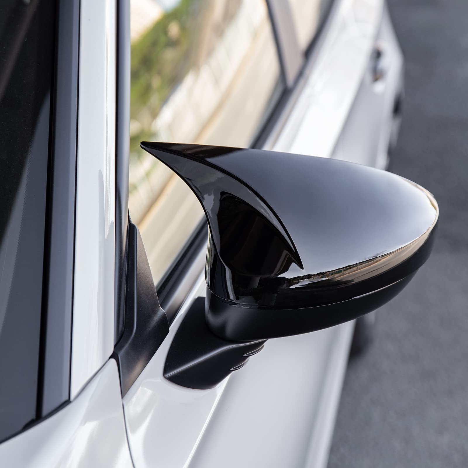CKE mirror cover protecting the original housing with a glossy black finish