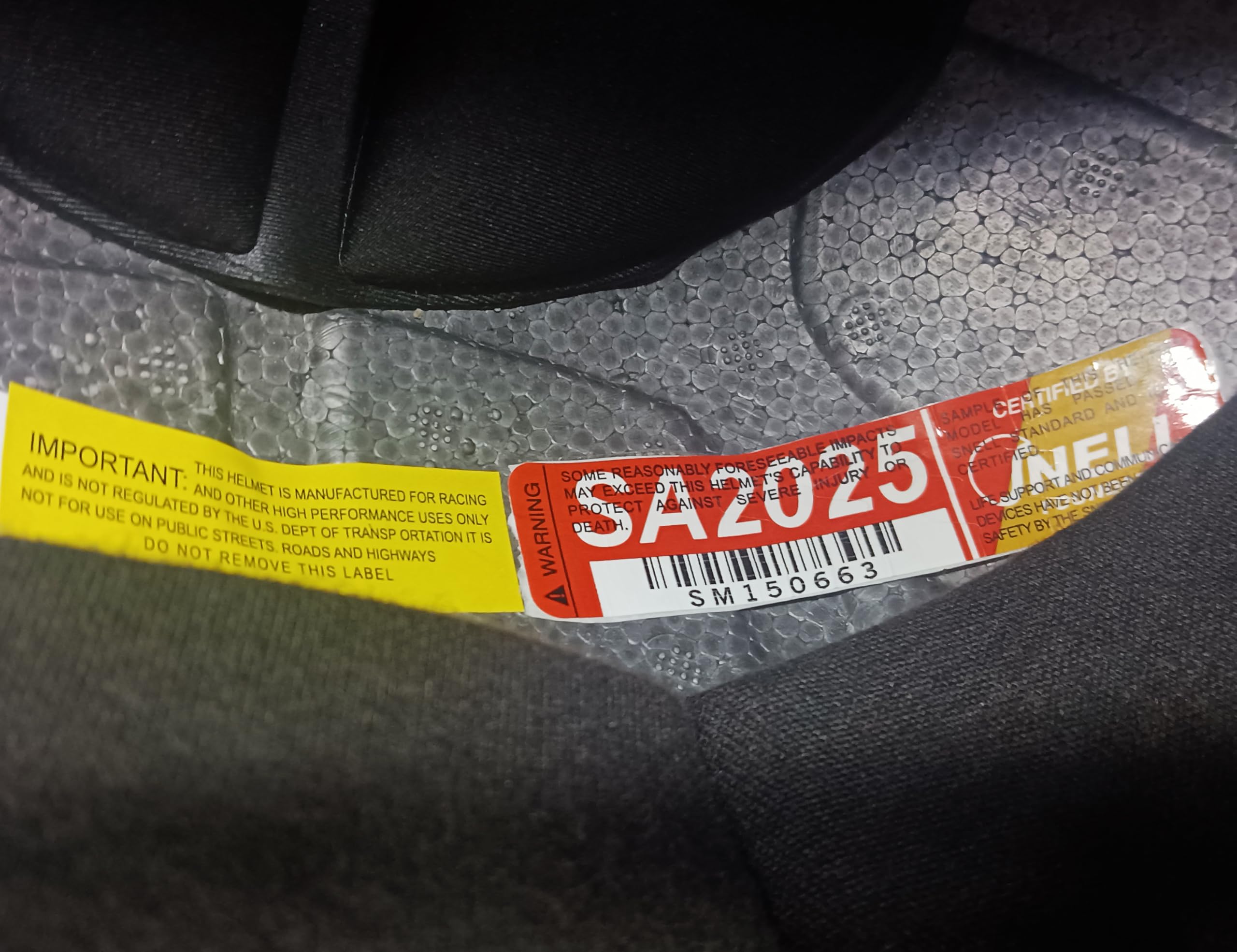 Conquer Snell SA2025 Kevlar chin strap detail supports secure durable fastening