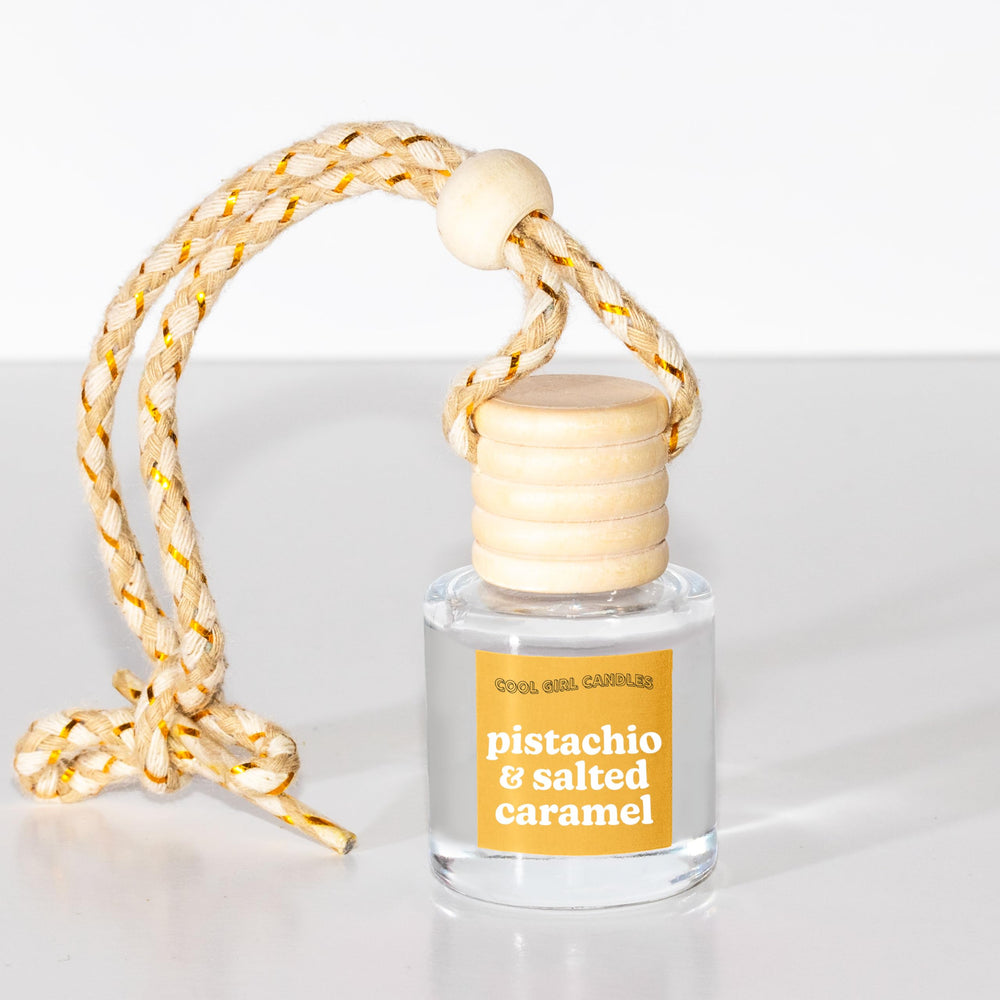 Cool Girl Candles car-hanging-diffuser in car cabin with refresh function.