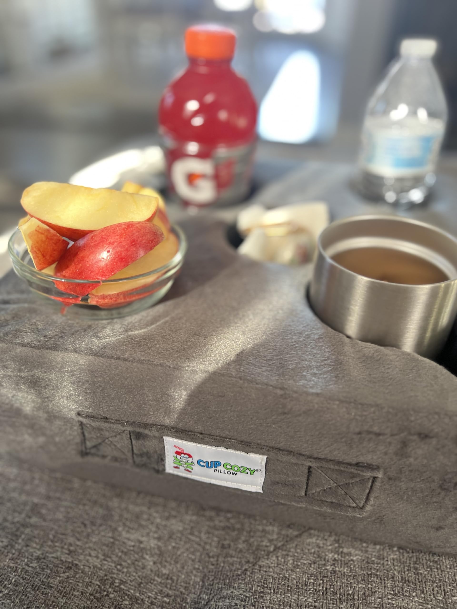 Cup Cozy Deluxe Pillow Gray in car stabilizes cups during travel