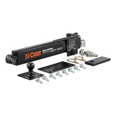 CURT sway control unit on trailer coupling reduces sway during turns.