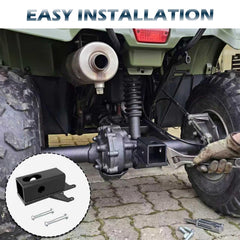 Dedomy ATV hitch in a muddy field ready for towing equipment.