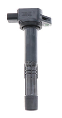 Denso 673-2301 ignition coil close-up showing space-saving stick-type design.