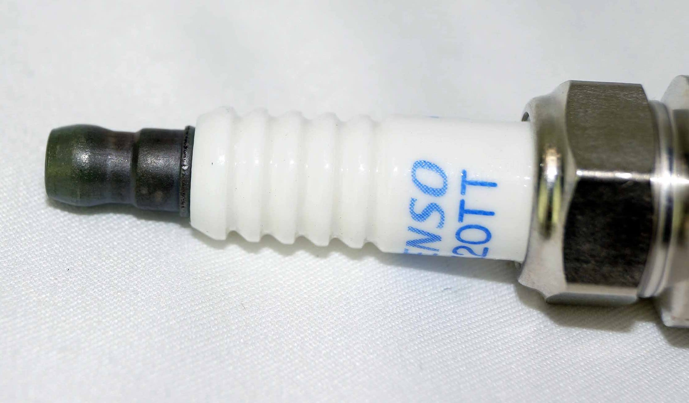 Denso Platinum TT spark plug component closeup for high-performance engines