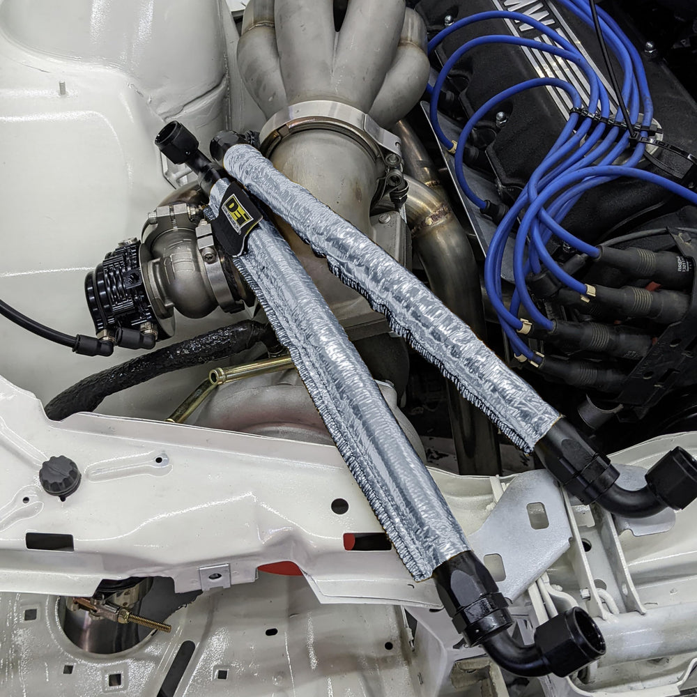 Design Engineering Heat Sheath protects lines from oil, chemicals, and debris in harsh environments.
