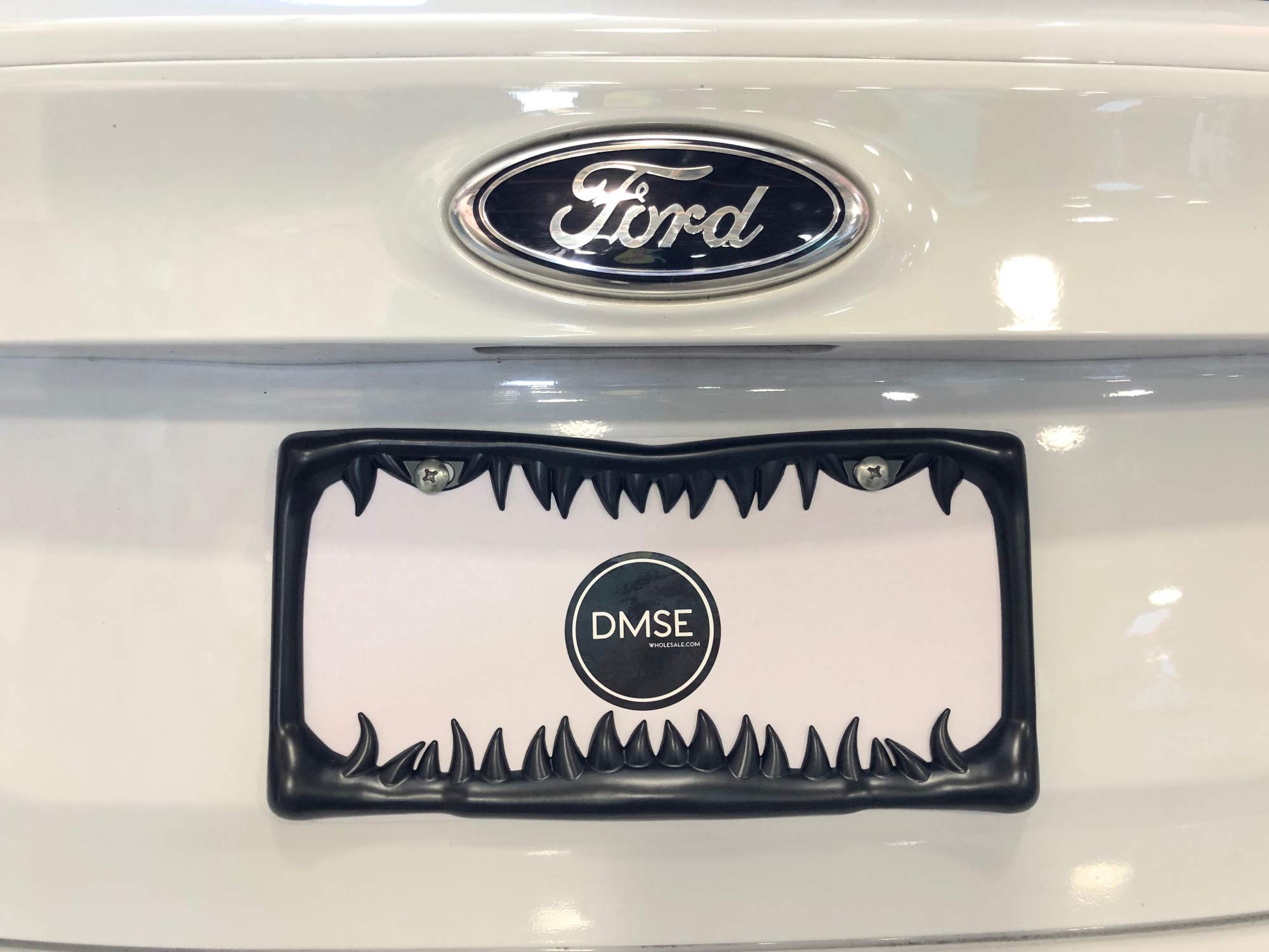 DMSE license frame with 3D teeth design enhances plate visibility while delivering gothic style.
