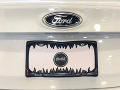 DMSE license frame with 3D teeth design enhances plate visibility while delivering gothic style.