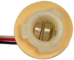 Dorman 85898 socket assembly side view shows extra-long leads for flexible wiring.