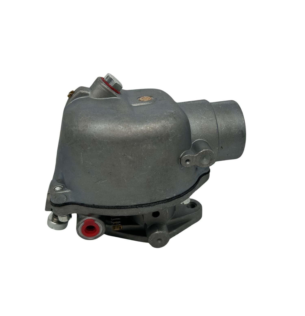 Dosens carburetor installed on tractor demonstrating simple mounting.
