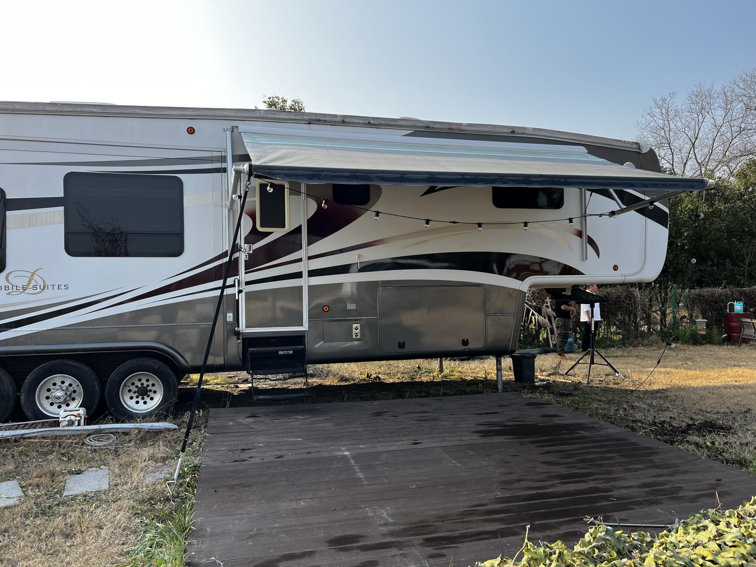 Dulepax ground setup with stakes securing the awning kit