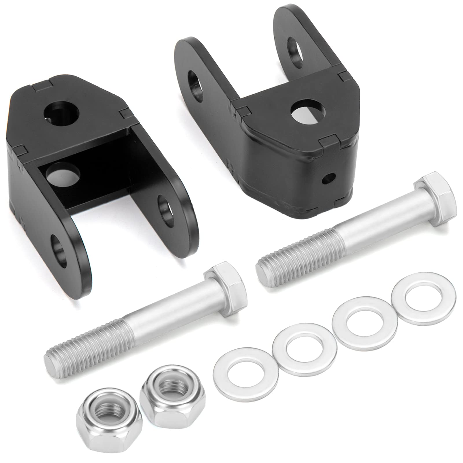 Dynofit rear shock extenders installed on a Silverado 1500 to improve suspension compatibility.