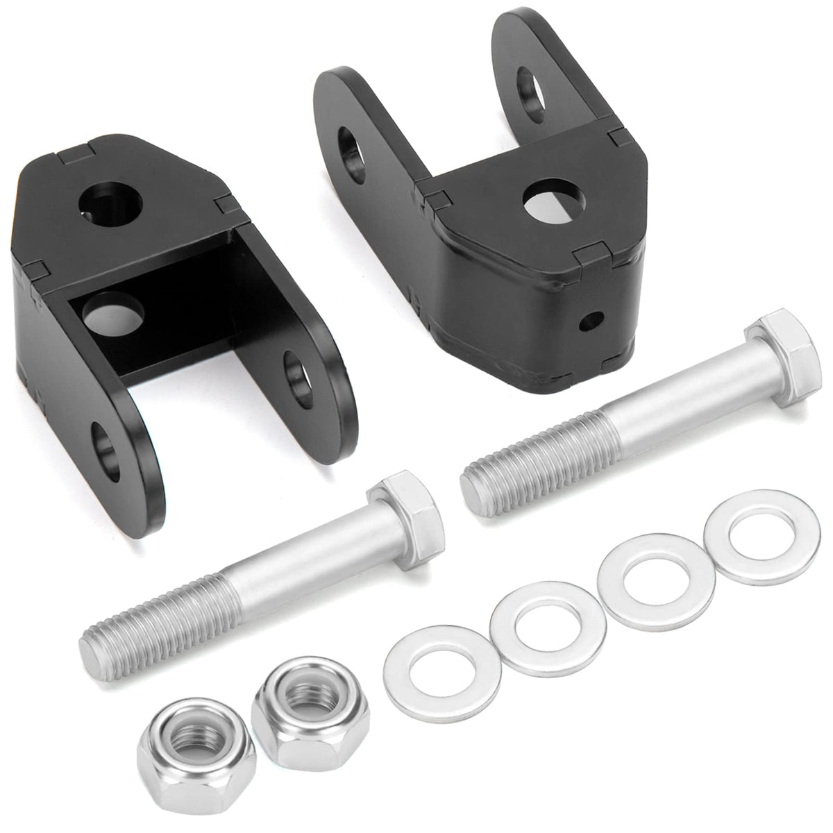 Dynofit rear shock extenders installed on a Silverado 1500 to improve suspension compatibility.