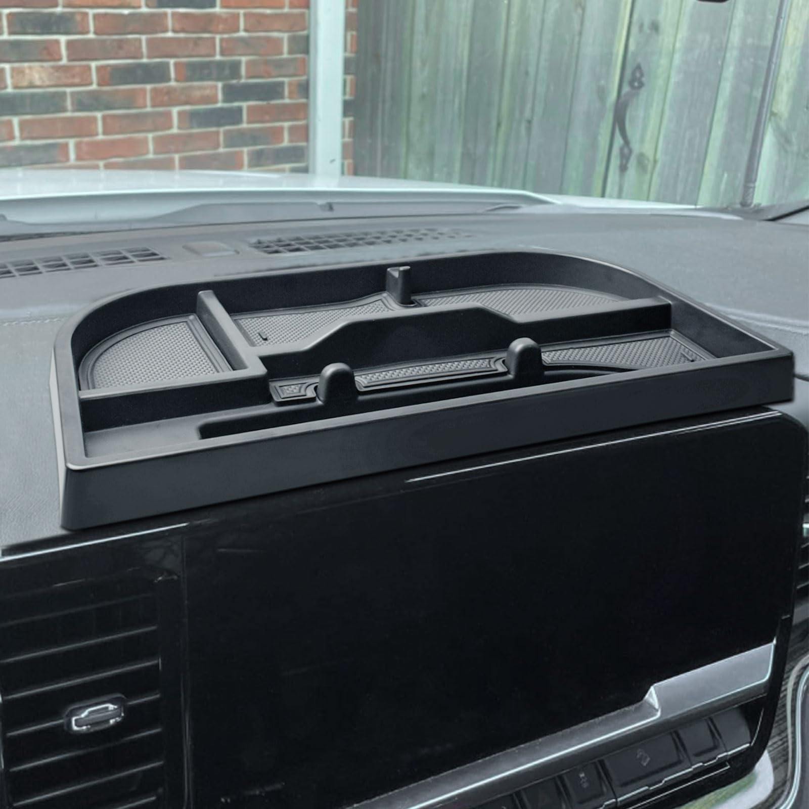 EDBETOS center-console organizer behind 13.4-inch display keeps essentials within reach.
