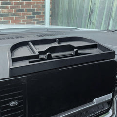 EDBETOS center-console organizer behind 13.4-inch display keeps essentials within reach.