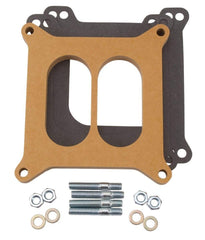 Edelbrock 8725 carb spacer shown above dual-plane intake for improved air-fuel flow and low-RPM torque.