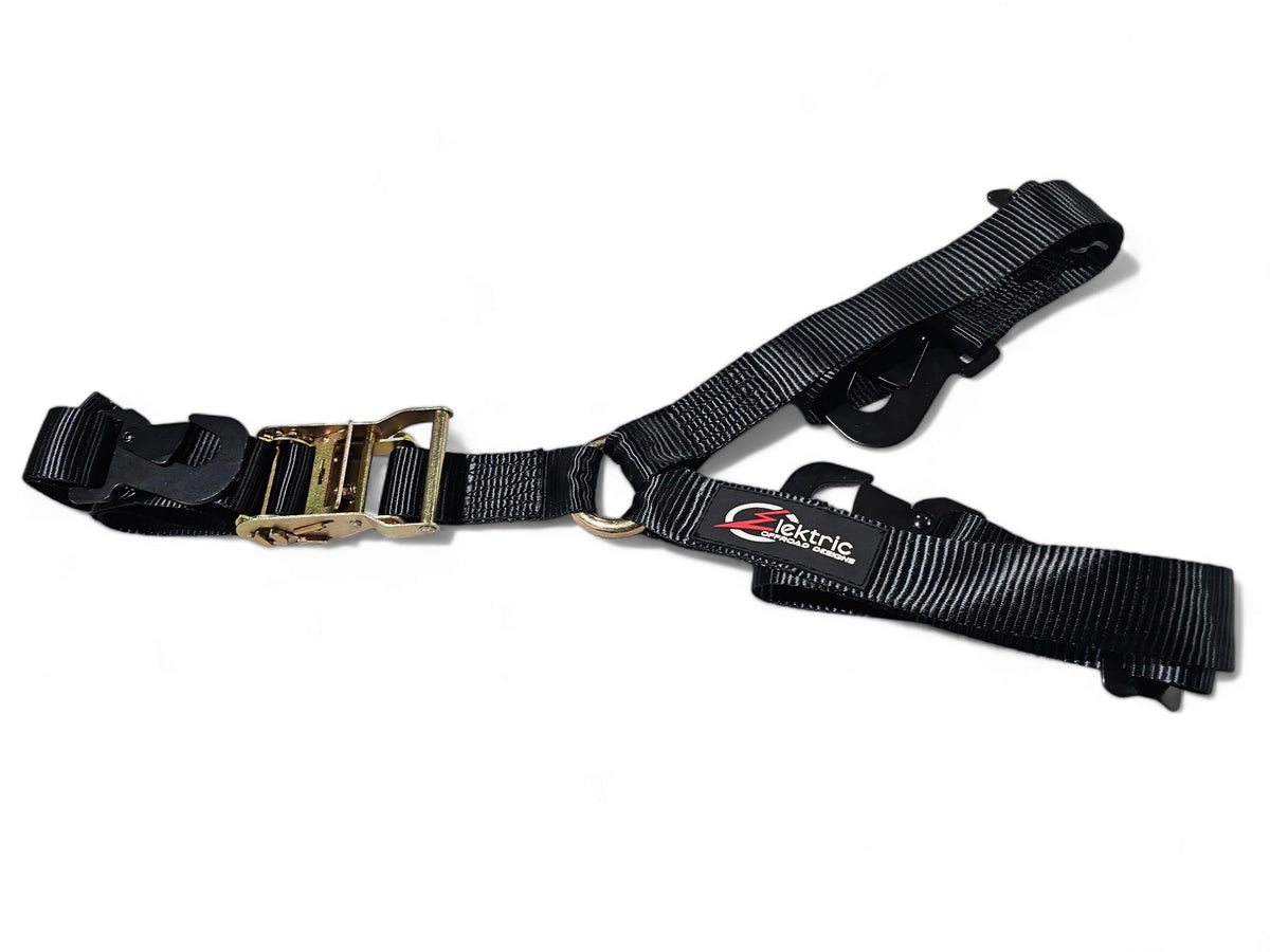 Elektric Offroad Designs Y Spare Tire Strap securing a spare tire on rugged trails.
