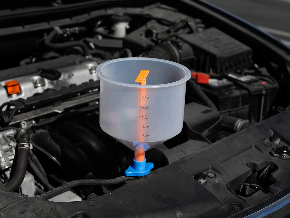 EPAuto spill-proof funnel kit in use shows clean, mess-free refills.