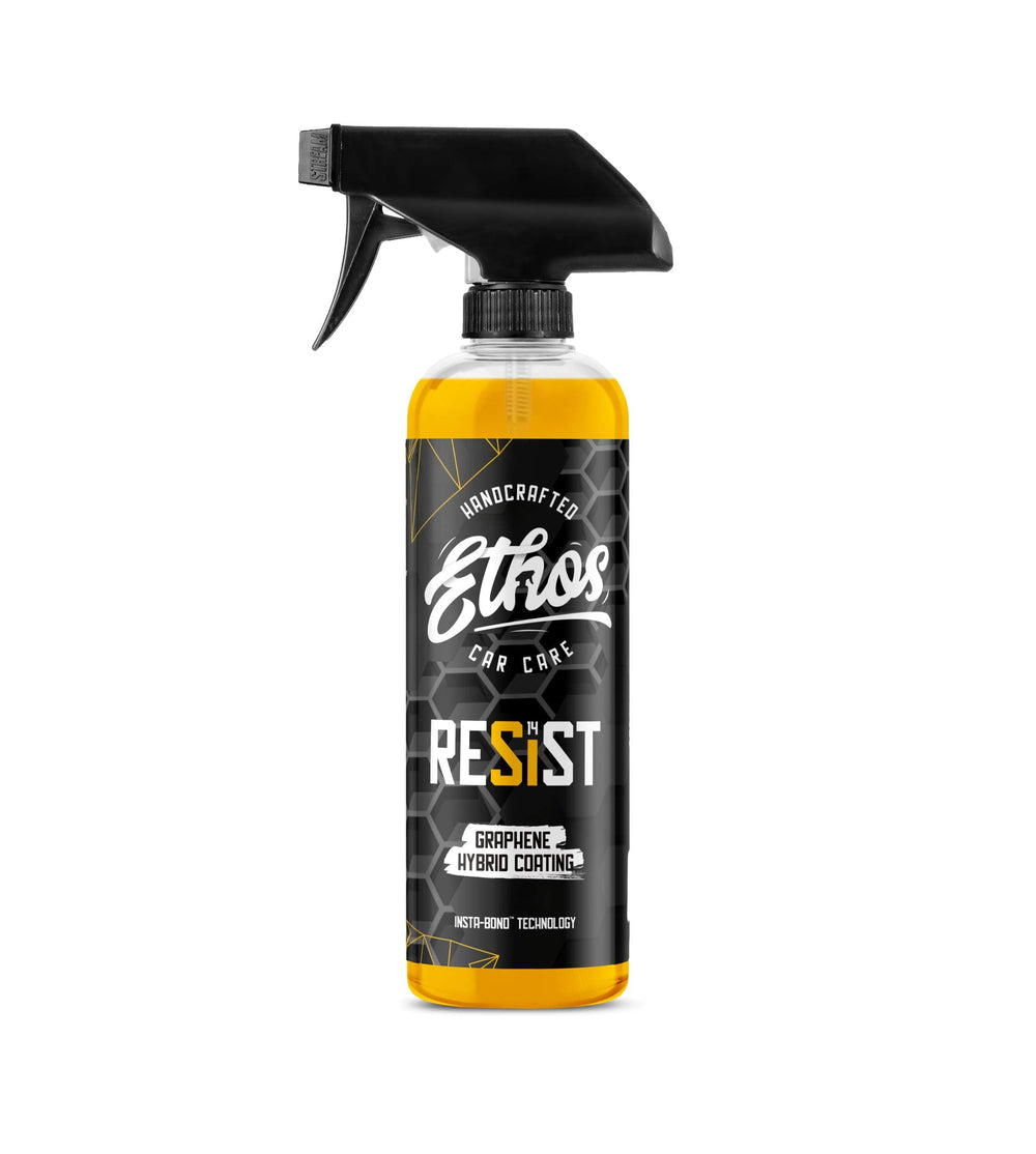 Ethos Resist graphene spray bottle applying coating to car finish for lasting gloss.