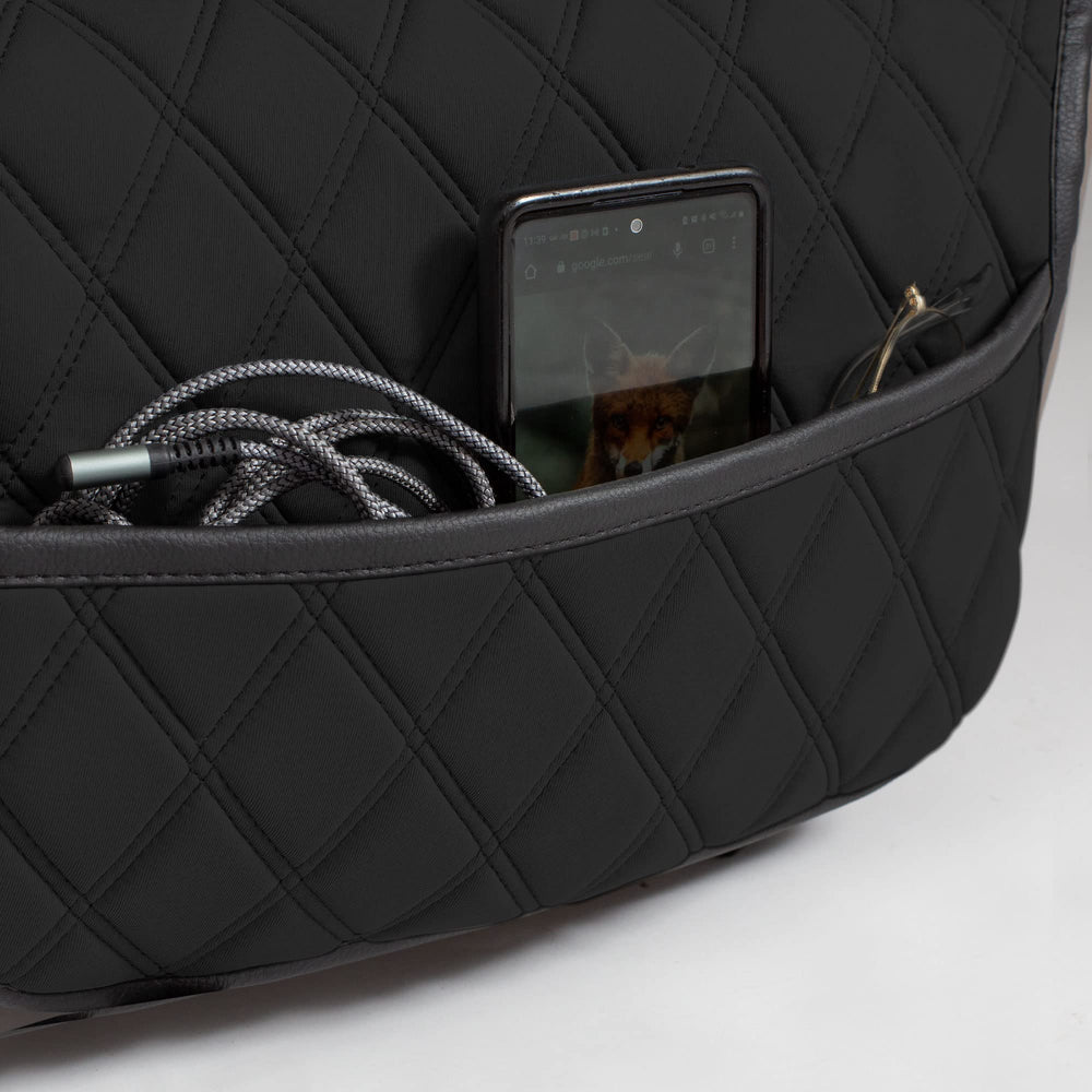 FH Group front seat cover with pockets keeps essentials organized.