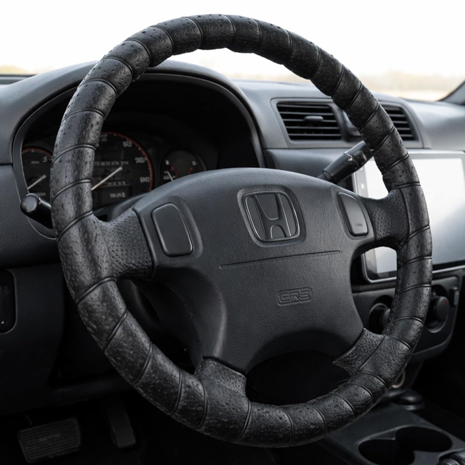 FINOO black lace-on steering wheel cover with universal 14-15 inch fit and secure lace-up design.