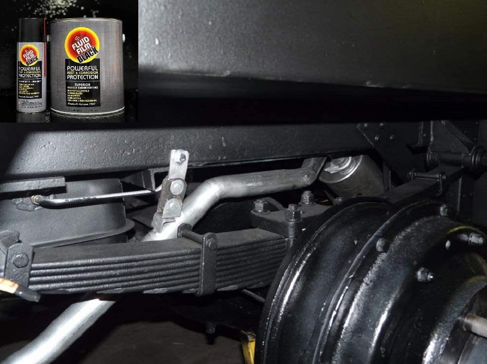 Close-up of Fluid Film 752-515 aerosol can in use on machinery.