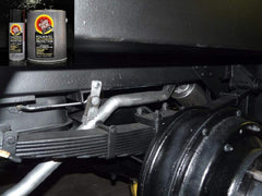 Close-up of Fluid Film 752-515 aerosol can in use on machinery.