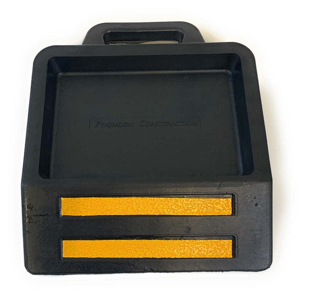 Foghorn Construction pallet jack wheel chock with base keeps trailers secure.
