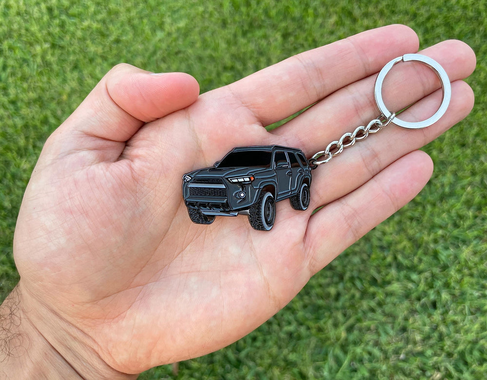 FOUR WHEEL BEAST 4Runner keychain enamel detail closeup showing color and texture.