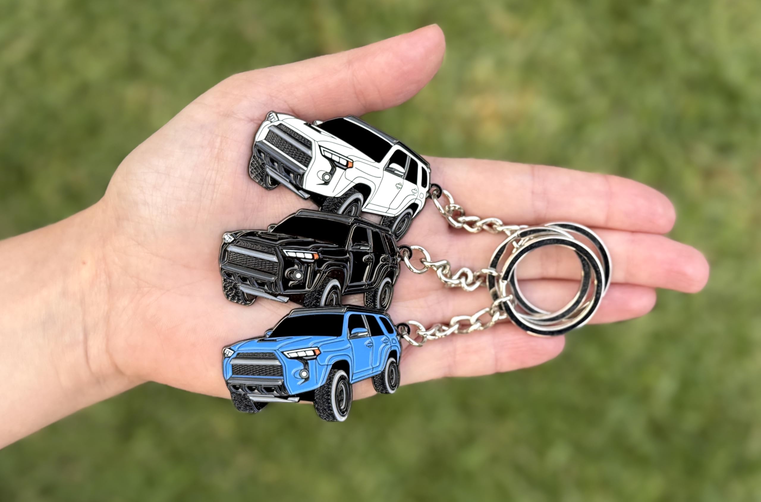 FOUR WHEEL BEAST 4Runner keychain metal body texture closeup for tactile quality.