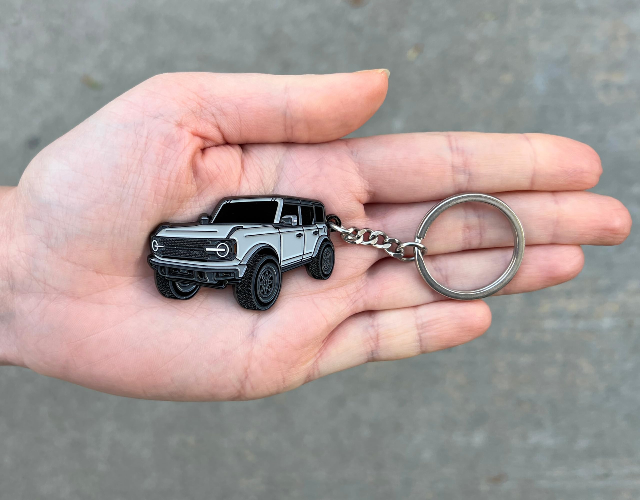FOUR WHEEL BEAST Bronco keychain cactus gray close-up shows enamel detail and everyday carry resilience.