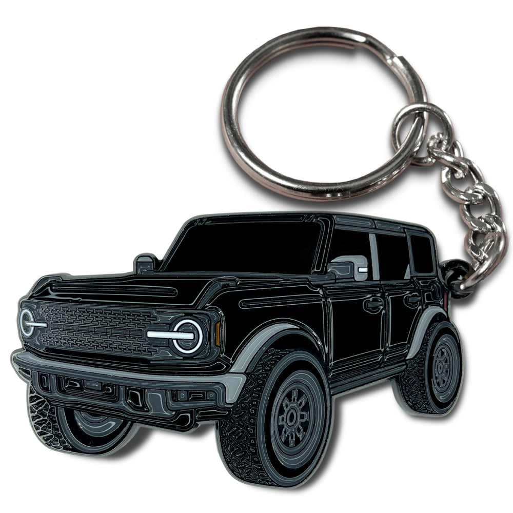 FOUR WHEEL BEAST Bronco keychain closeup of durable metal enamel craftsmanship.
