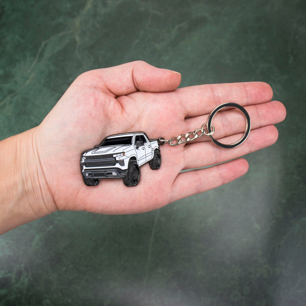 Four Wheel Beast keychain white side view, compact portable Chevy truck accessory.