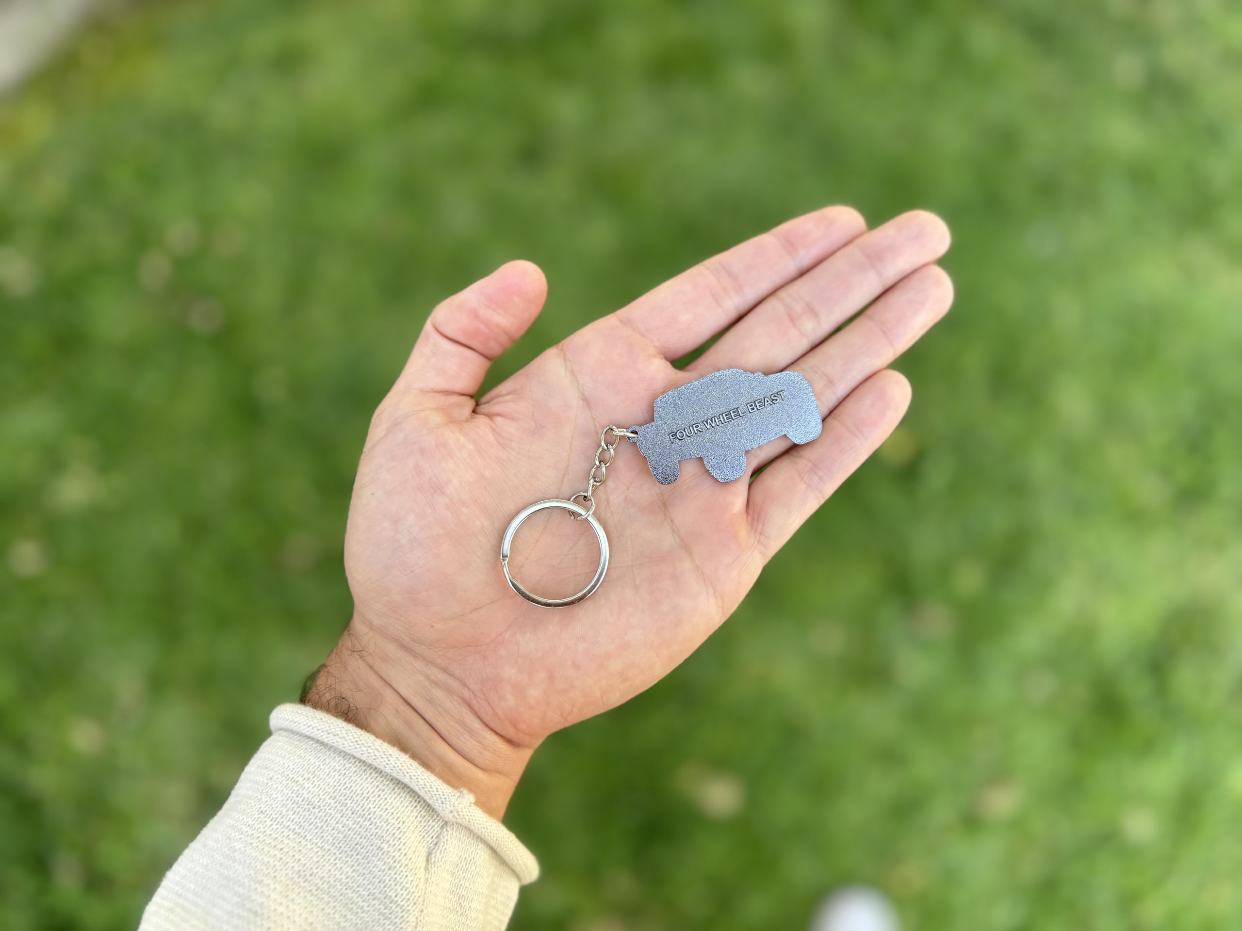 FOUR WHEEL BEAST Tacoma keychain Black with sturdy enamel, a reliable desk or key tag.