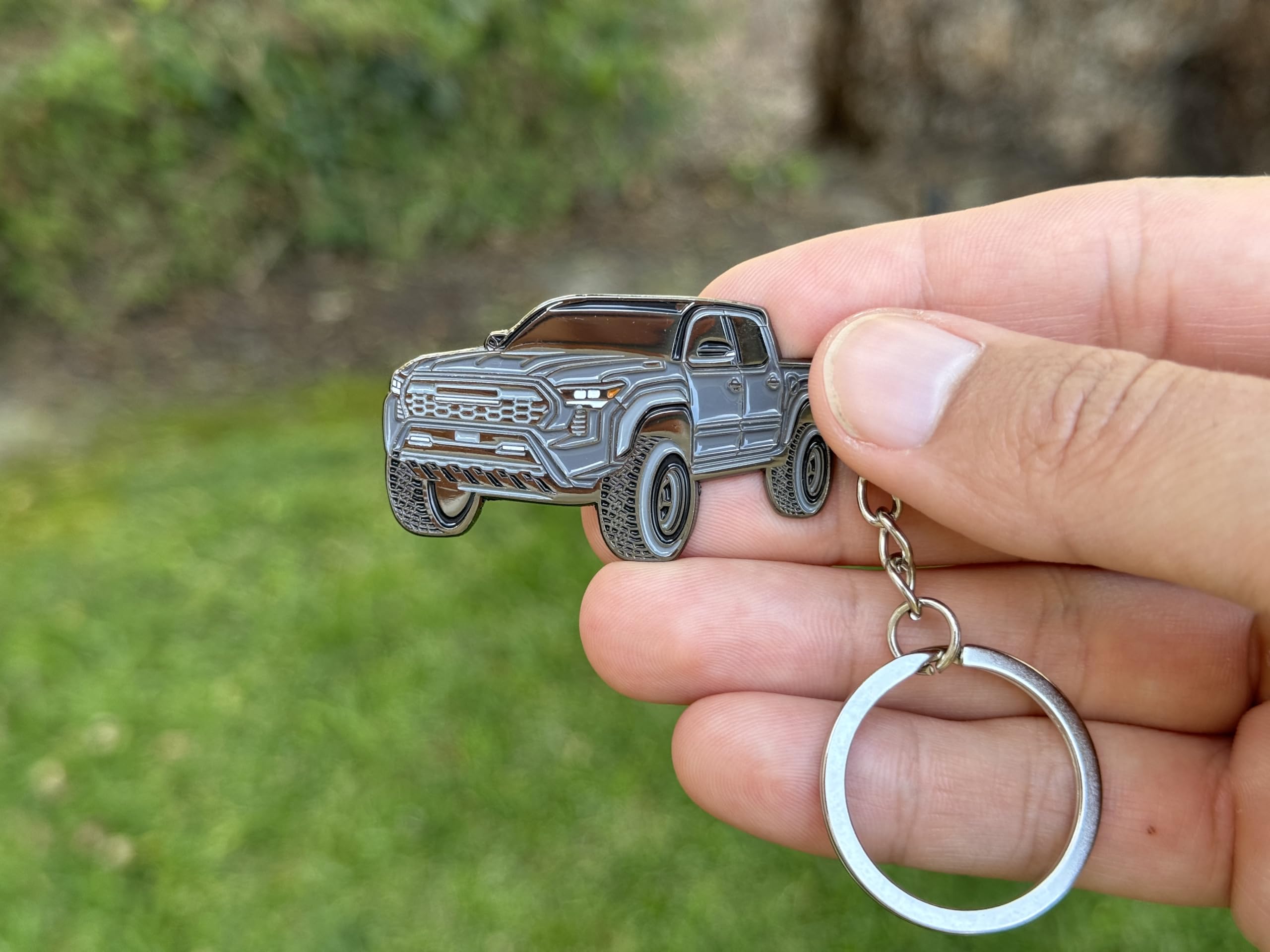 FOUR WHEEL BEAST Tacoma keychain Blue with raised metal details, enhances your Tacoma accessories.