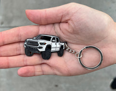 FOUR WHEEL BEAST Tacoma keychain in Inferno Red offers a bold accessory for your rig.