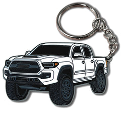 FOUR WHEEL BEAST Tacoma keychain in Quicksand color with durable metal enamel finish.