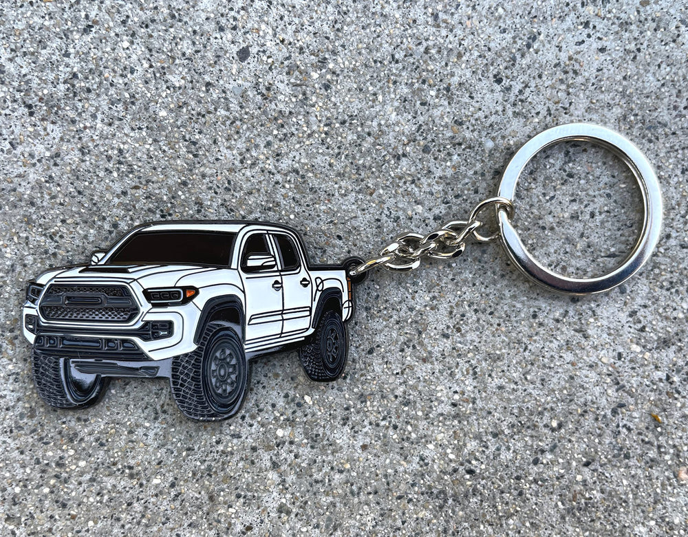 FOUR WHEEL BEAST Tacoma keychain in Silver shines with enamel detail and sturdy metal.