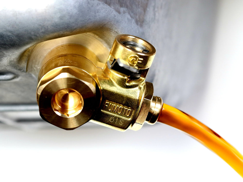 Fumoto F108SX valve open position ready to drain