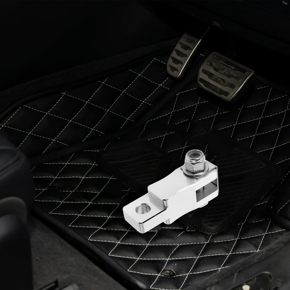 Garneck silver finish pedal extender adds durability and style to Peterbilt cabin.