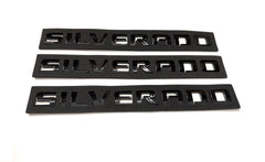 Generic black finish badge emblems close-up, bold exterior detail