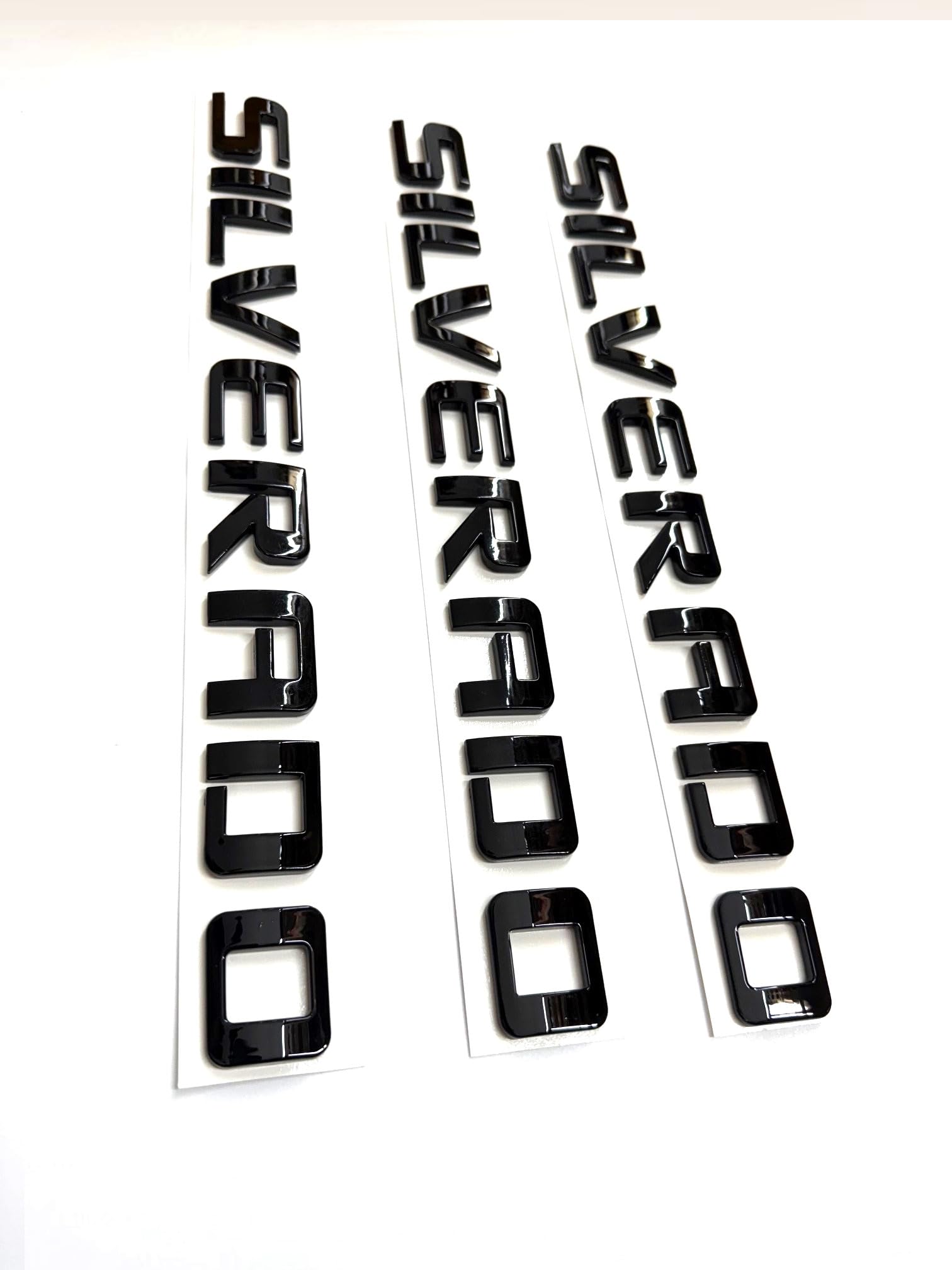 Generic badge emblems for Silverado 2007-2020 with black finish, subtle exterior upgrade