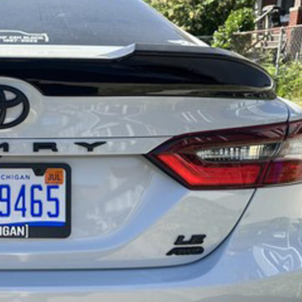 Generic emblem overlay offers bold matte finish and durable adhesion for Camry XSE.